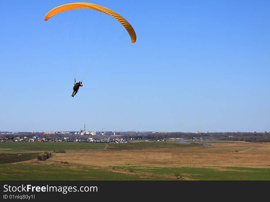 The glider pilot soars in a dynamic stream near a slope. The glider pilot soars in a dynamic stream near a slope.