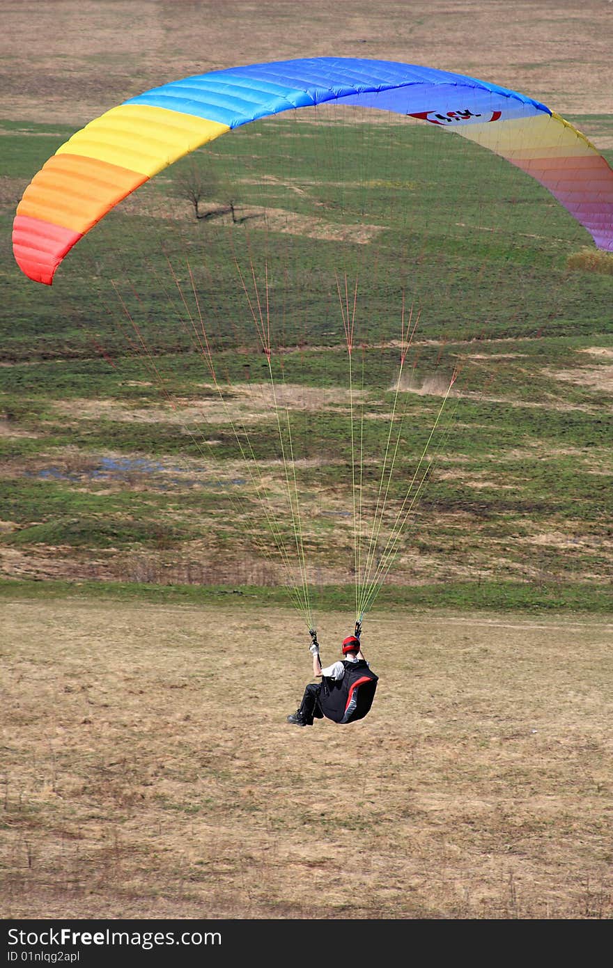 The glider pilot soars in a dynamic stream near a slope. The glider pilot soars in a dynamic stream near a slope.