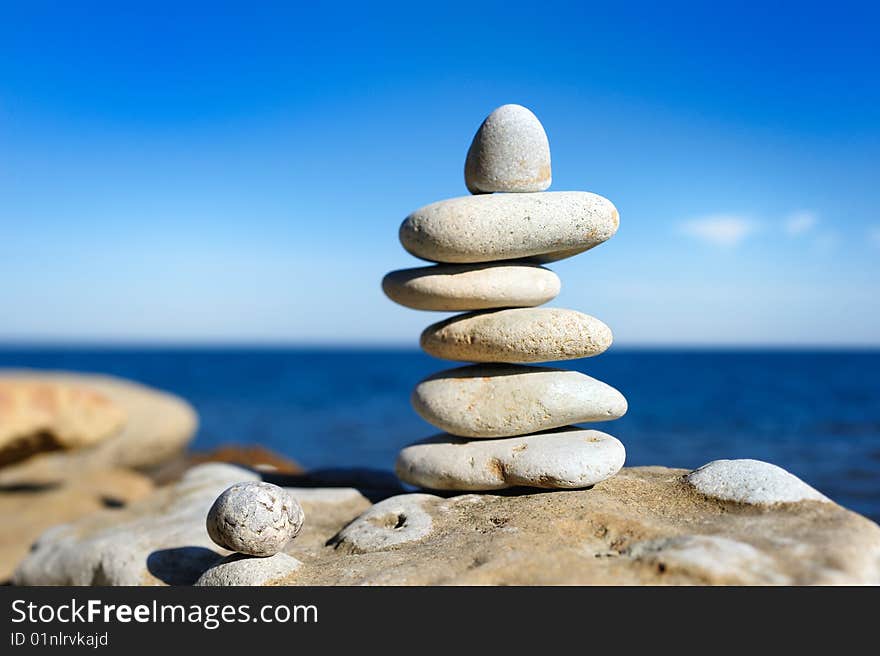 Handful of white pebbles built one after another. Handful of white pebbles built one after another