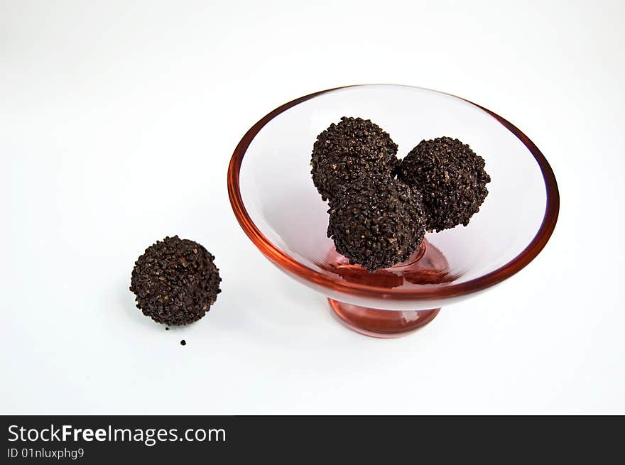 Round chocloate sweets on a candy dish