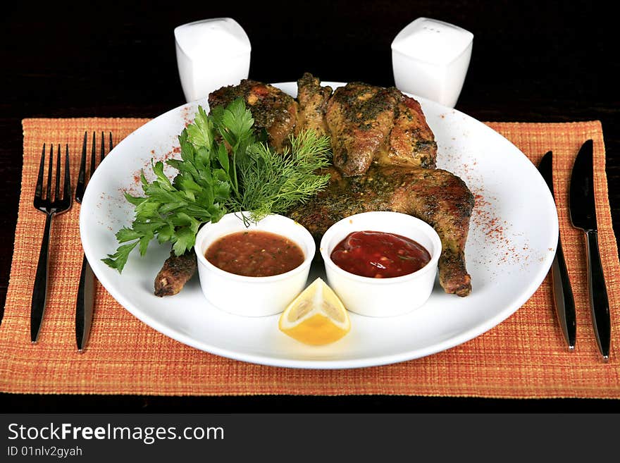 Roasted whole chicken on a plate