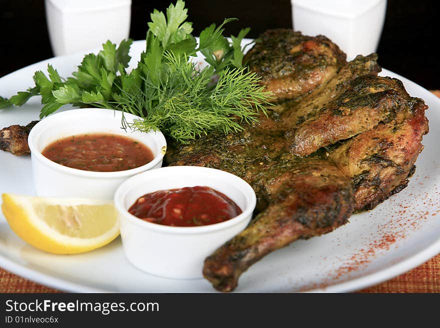 Roasted whole chicken on a plate