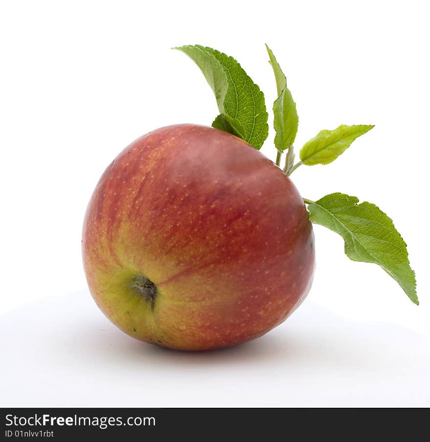 Red with leaves apple isolated on a white background. Red with leaves apple isolated on a white background