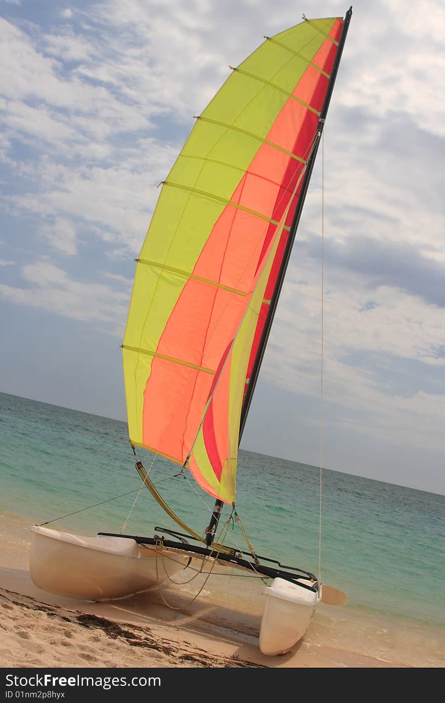 Catamaran with colored sail at the Caribbean Sea