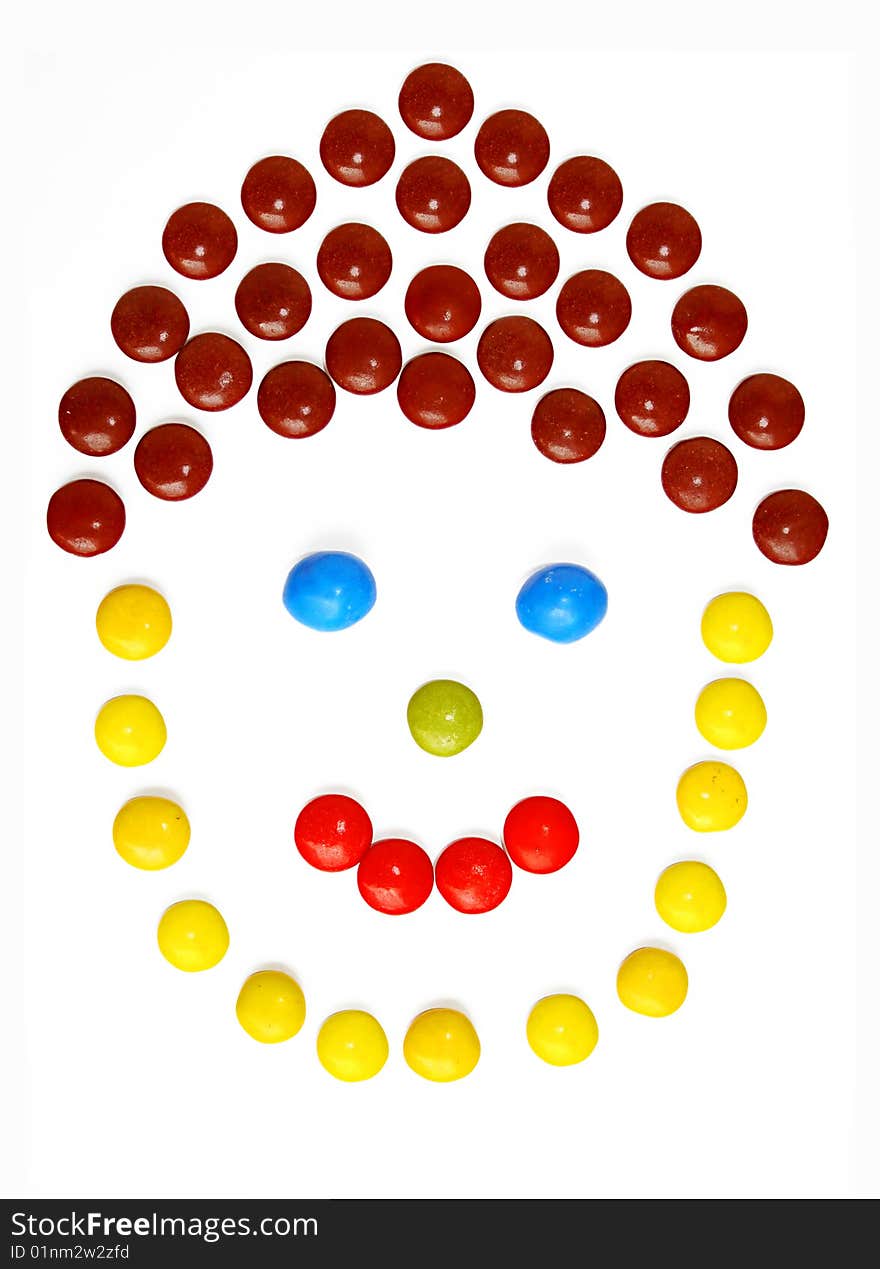 An image of a smiling face made of sweets. An image of a smiling face made of sweets