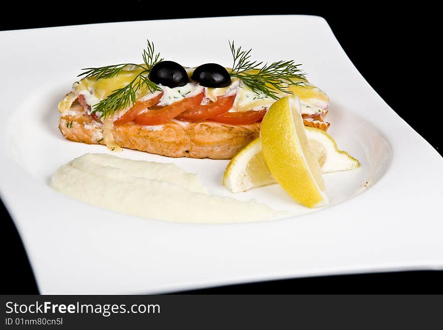 Fish is fried tomatoes of olive greenery. Fish is fried tomatoes of olive greenery