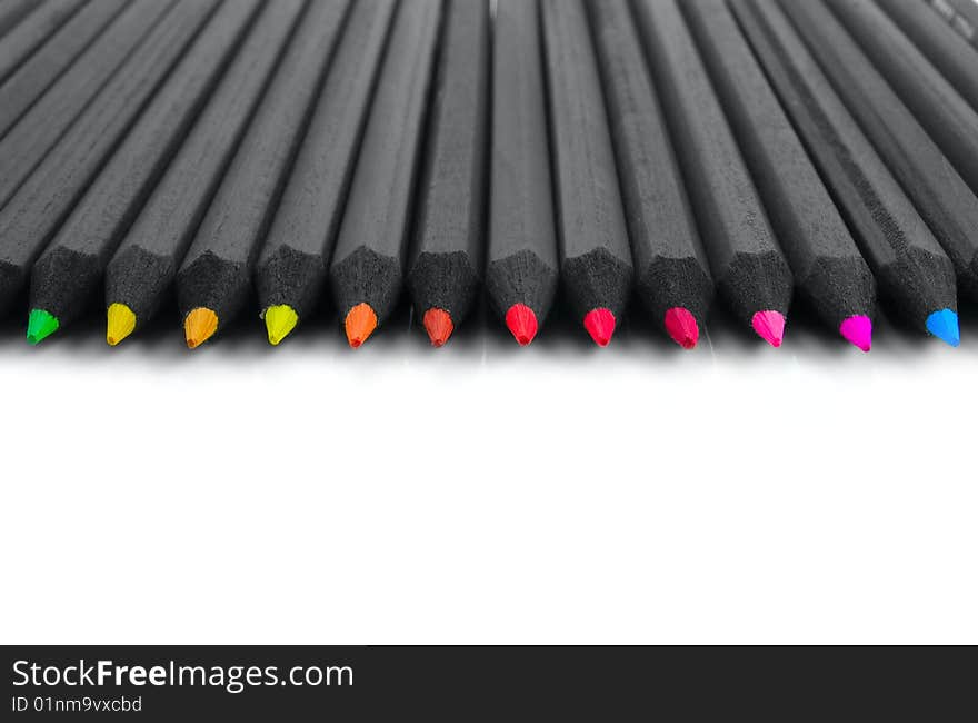 Black colored pencils on a white background. Black colored pencils on a white background