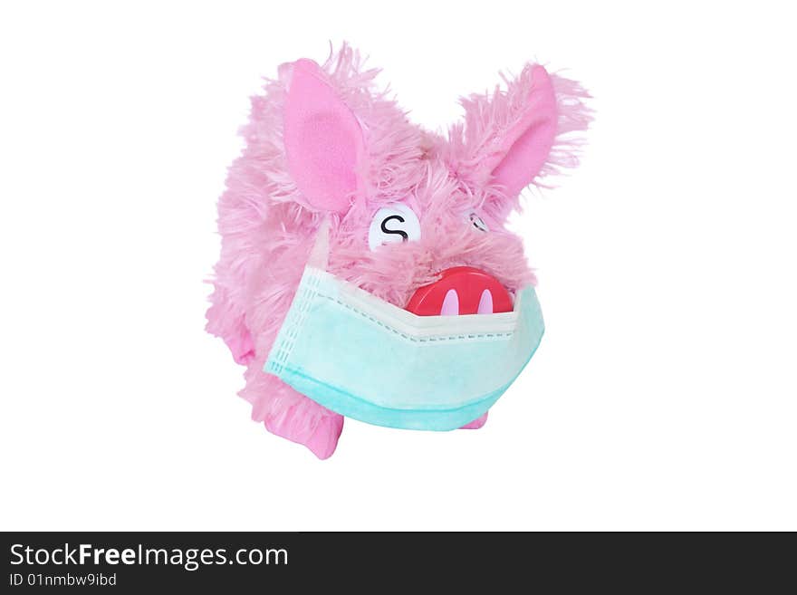 Pink toy pig with earloop mask isolated on white background. Anti swine flu concept. Pink toy pig with earloop mask isolated on white background. Anti swine flu concept.