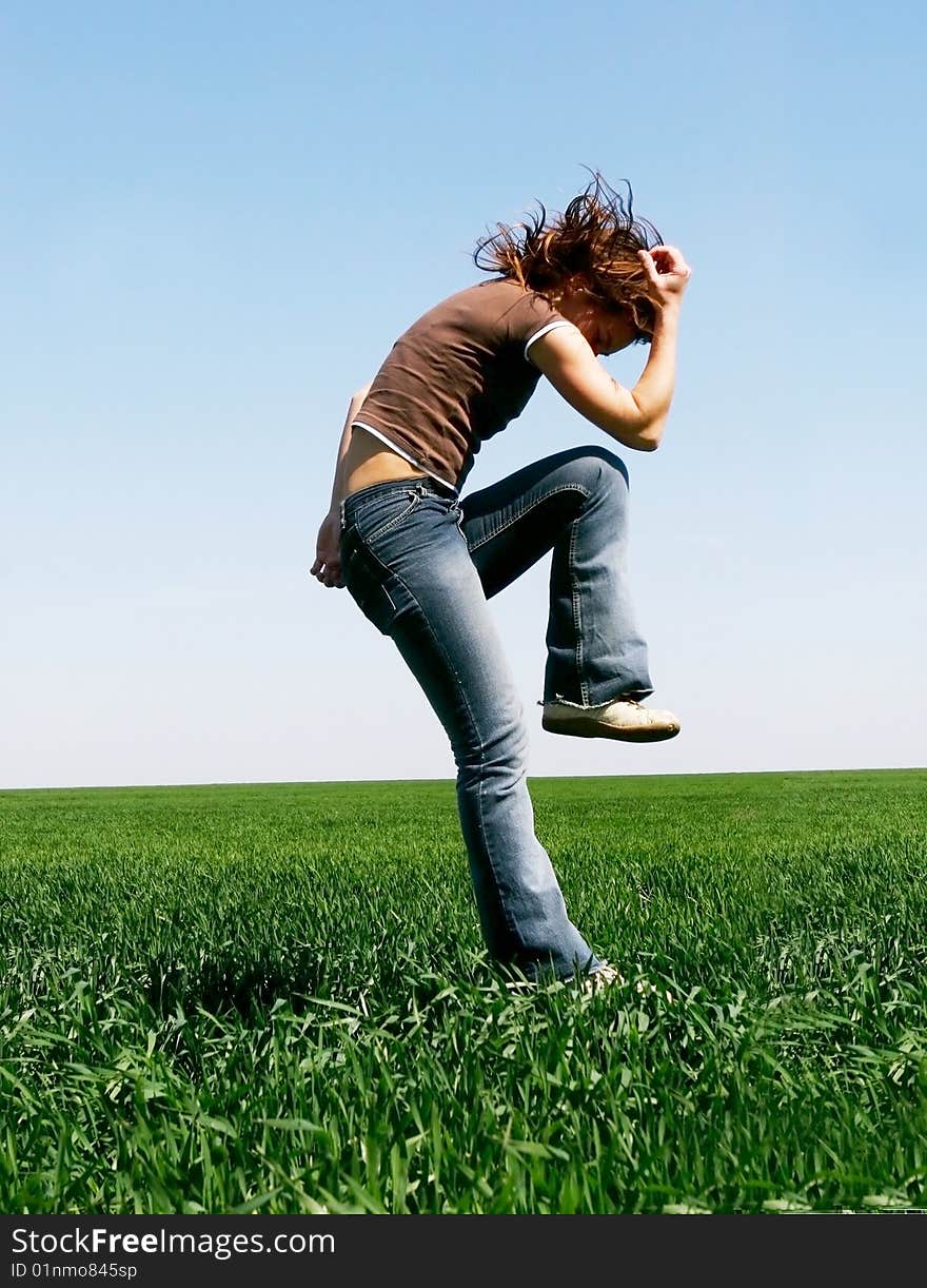 Jumping girl on natural background