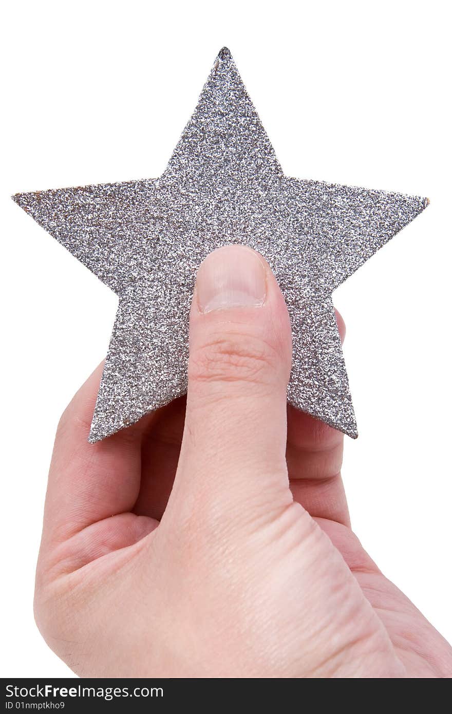 Silvery star in a hand isolated on a white background. Silvery star in a hand isolated on a white background