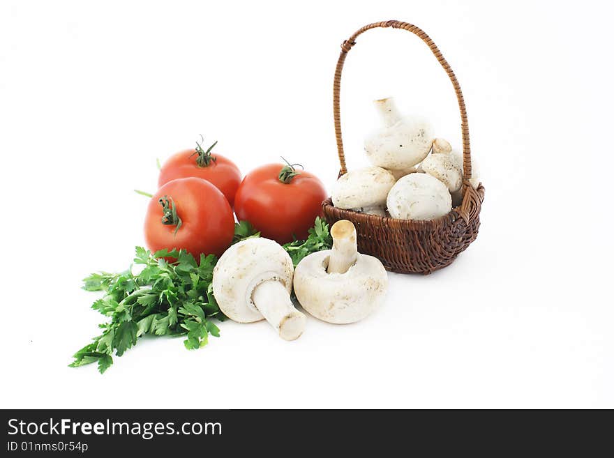 Basket, tomatoes, mushrooms and parsley. Basket, tomatoes, mushrooms and parsley