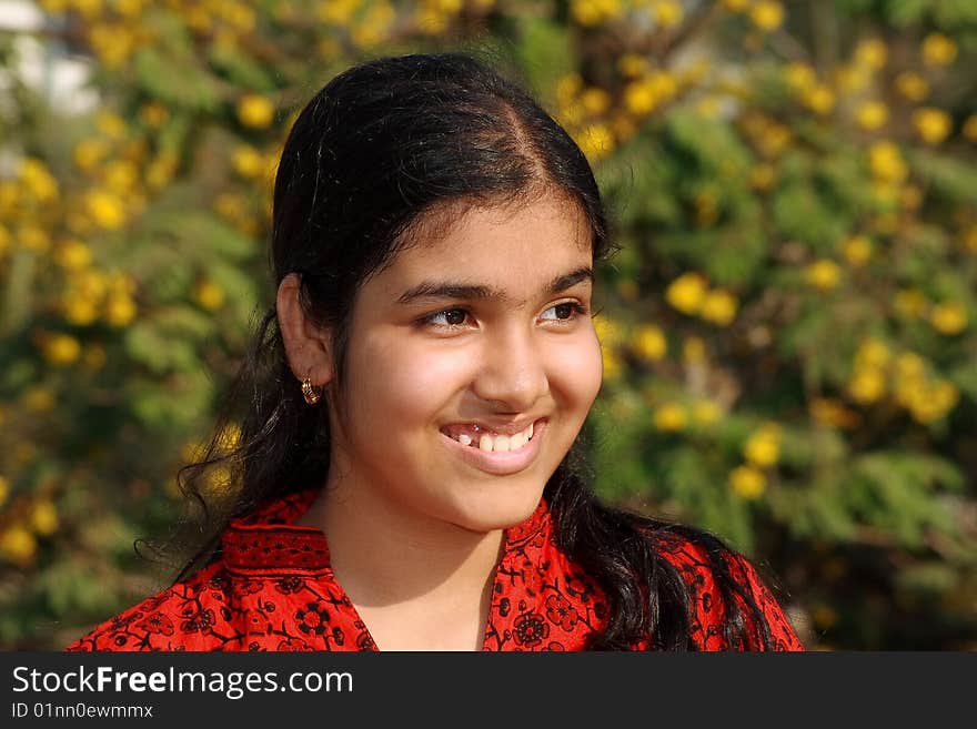 A sweet smile of a young girl's portrait.