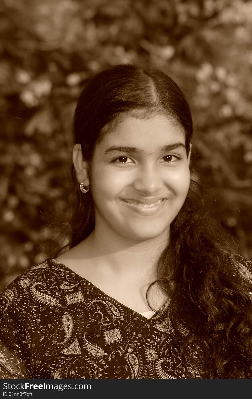 A sweet and simple smile of a young girl's portrait. A sweet and simple smile of a young girl's portrait.