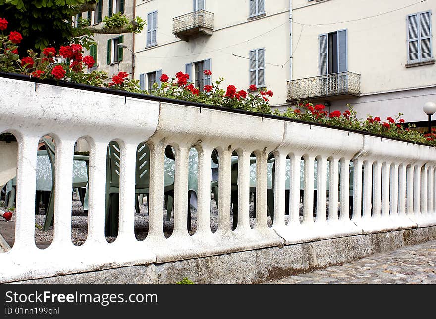 White balustrade with vases of flowers