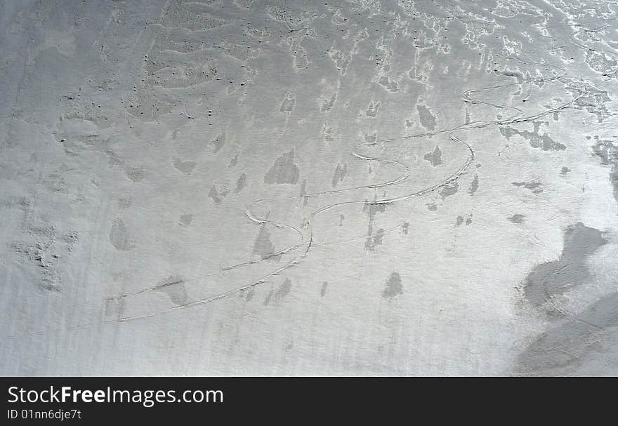 Snow in contra light with paths and marks, early spring on mountains