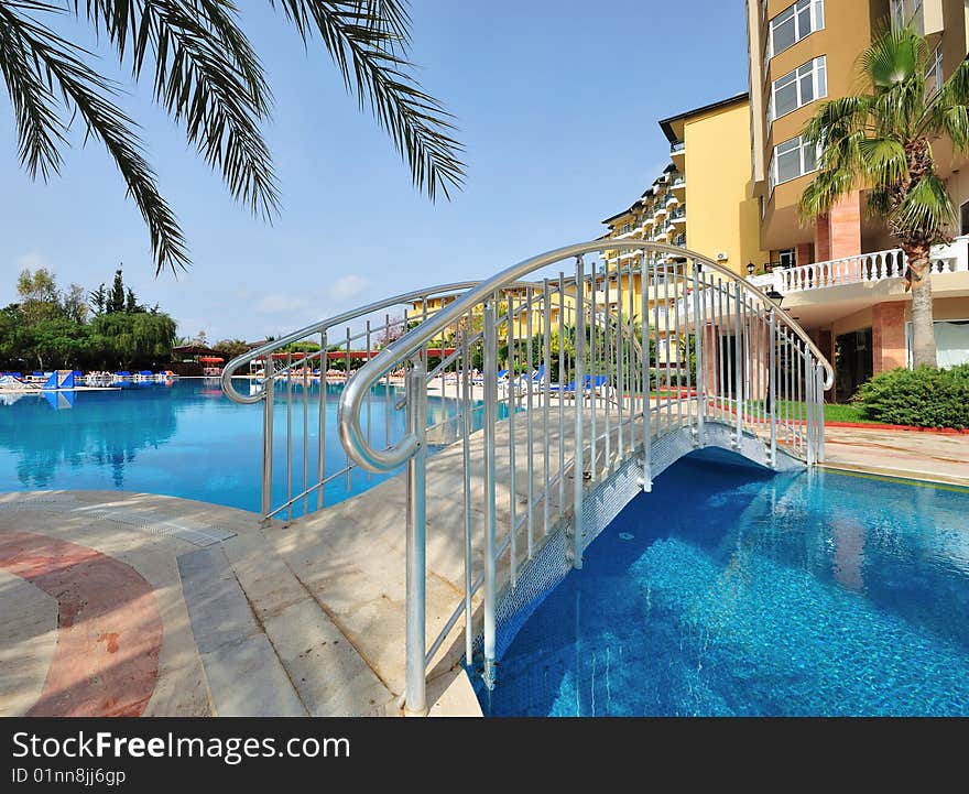 Small bridge across resort's pool. Small bridge across resort's pool