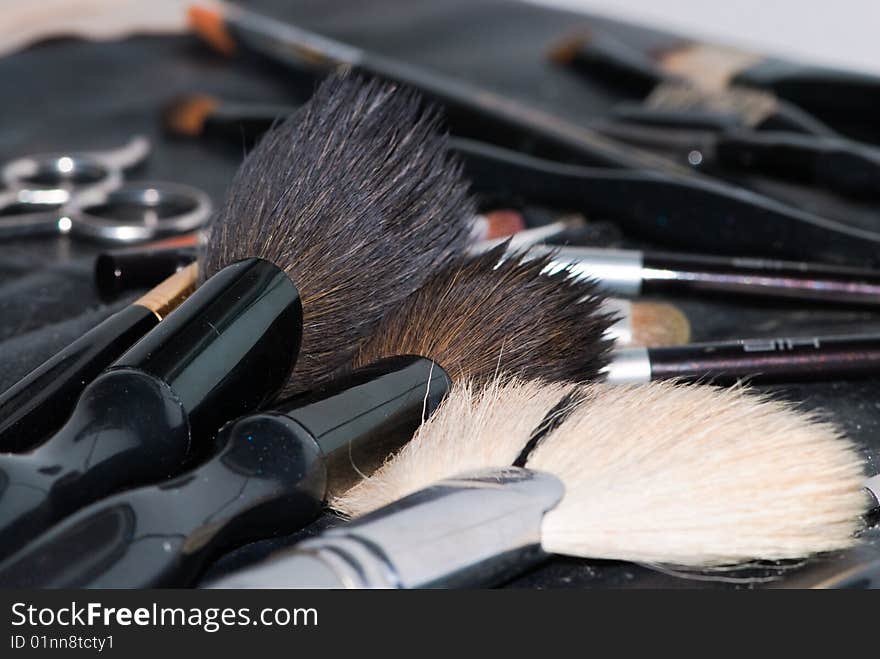 Pictures of cosmetic brushes and color powders. Pictures of cosmetic brushes and color powders