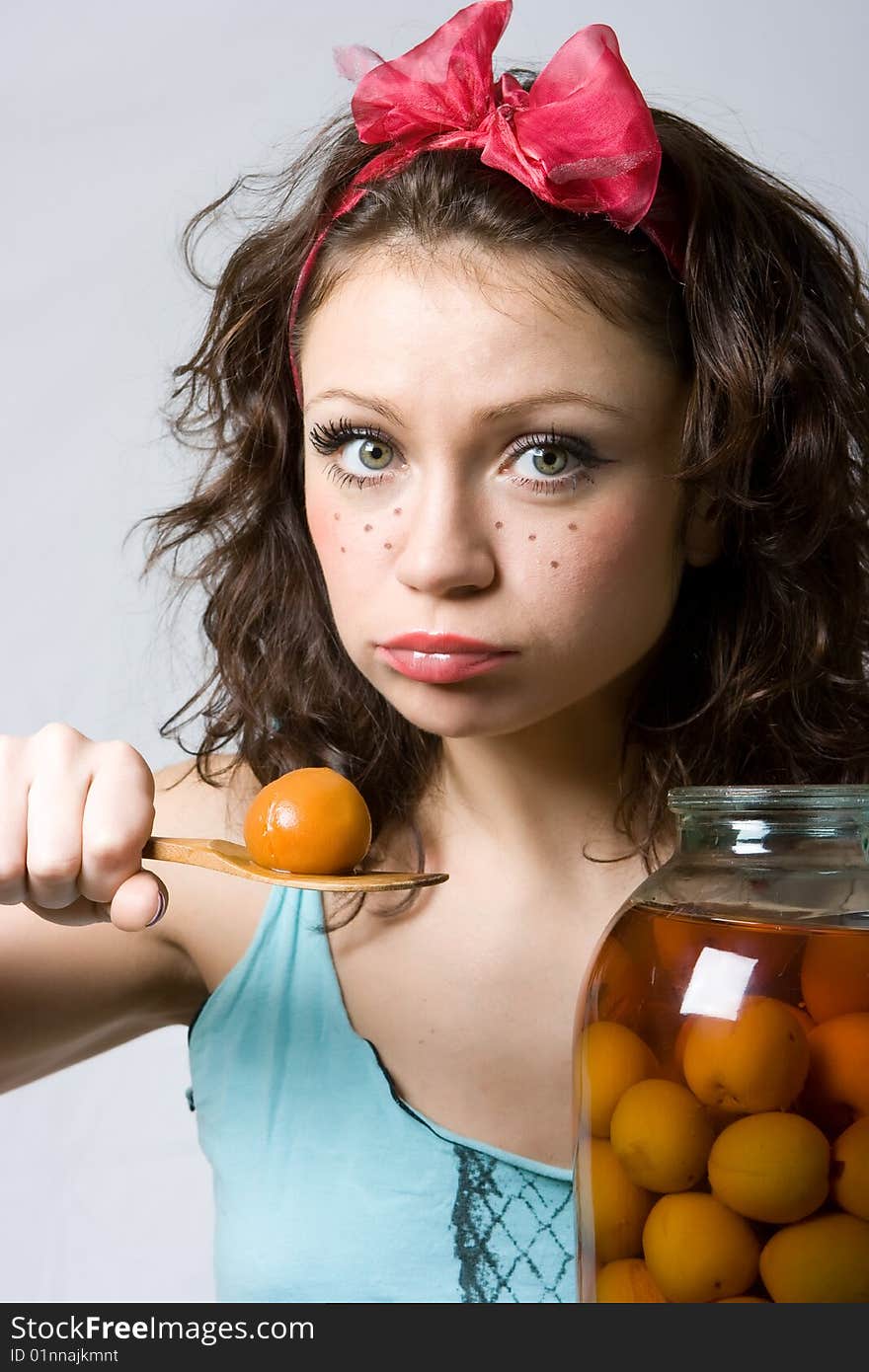 Girl wanting to eat this stewed apricot. Girl wanting to eat this stewed apricot