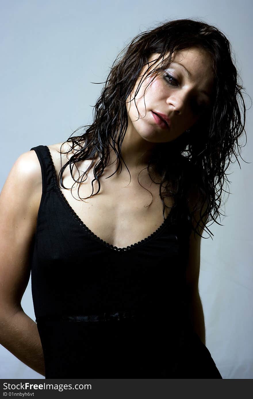 Sad model with wet hair in studio shot. Sad model with wet hair in studio shot