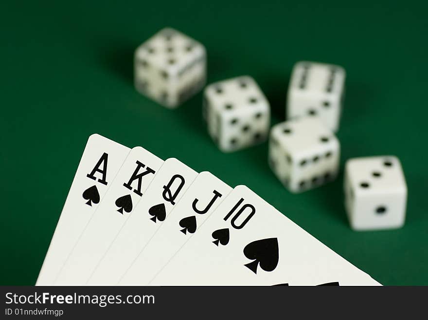 Royal Flush Spades and dices on green background