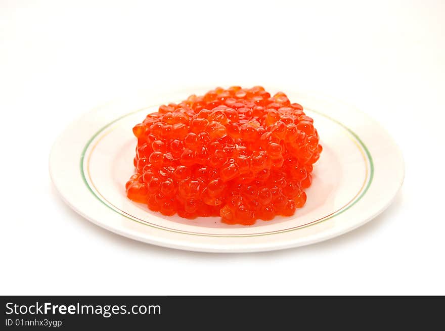 Red caviar on plate isolated white