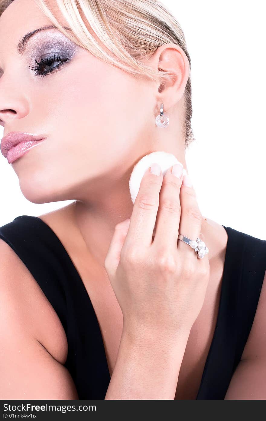 Beautiful young woman applying foundation on neck, isolated on white background. Beautiful young woman applying foundation on neck, isolated on white background