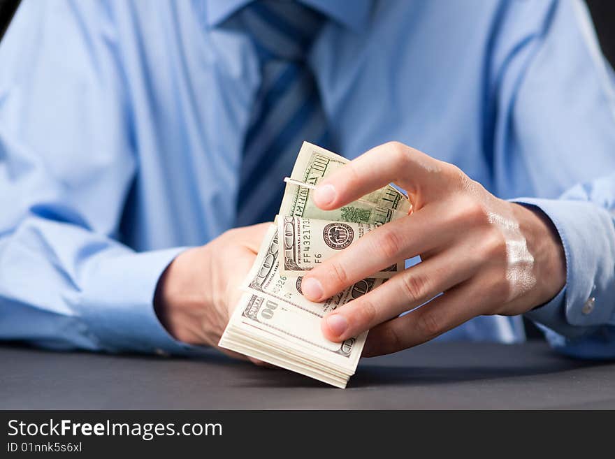 Businessman counting Money (100 dollars notes). Businessman counting Money (100 dollars notes)