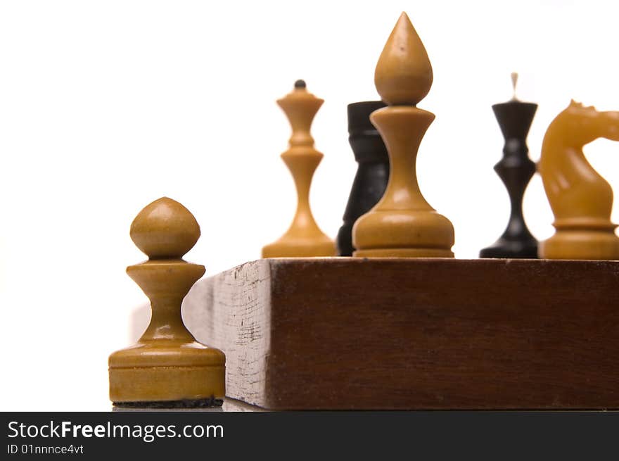 Chessmen on a chessboard, white background