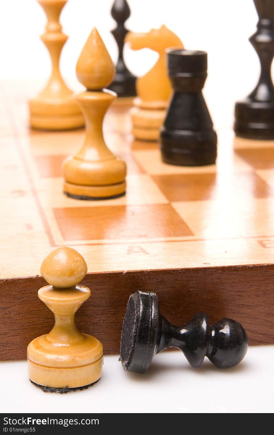 Chessmen on a chessboard, white background