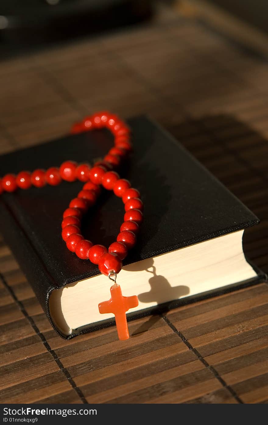 Book and red beads with cross. Book and red beads with cross