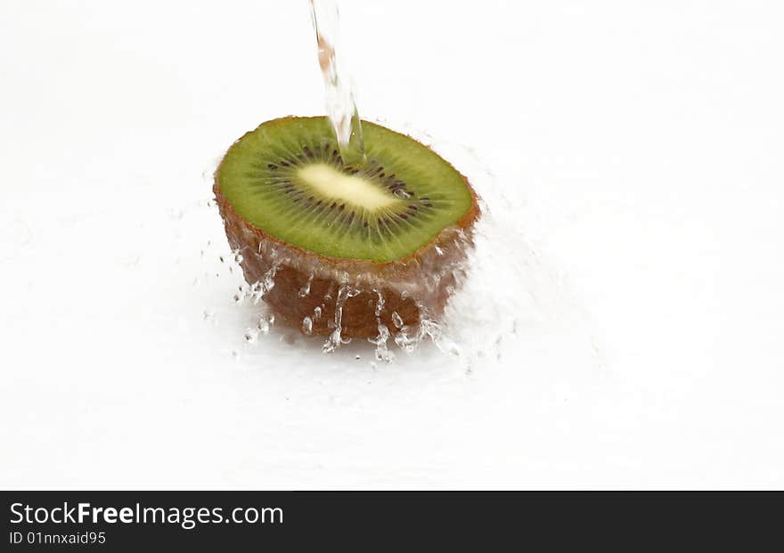 Half Of Juicy,ripe Kiwi With Drops Of Water.