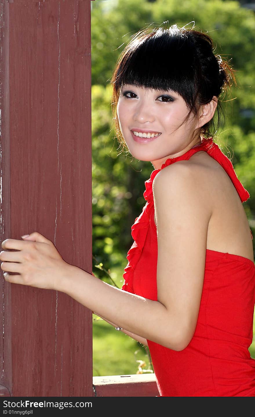 A beautiful Asian girl is in the portrait outdoors. A beautiful Asian girl is in the portrait outdoors.