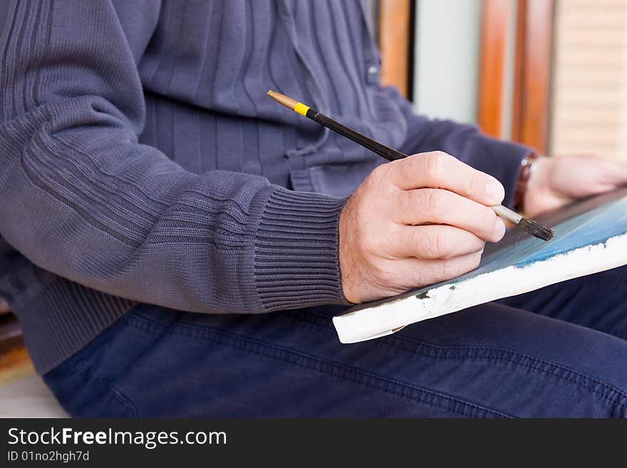 An artist drawing a landscape