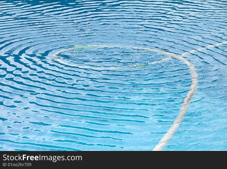 Water ripple in a very blue swimming pool