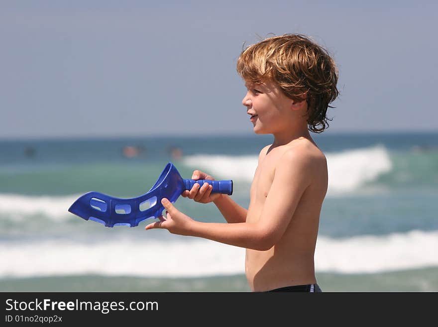 Boy Playing at Beach