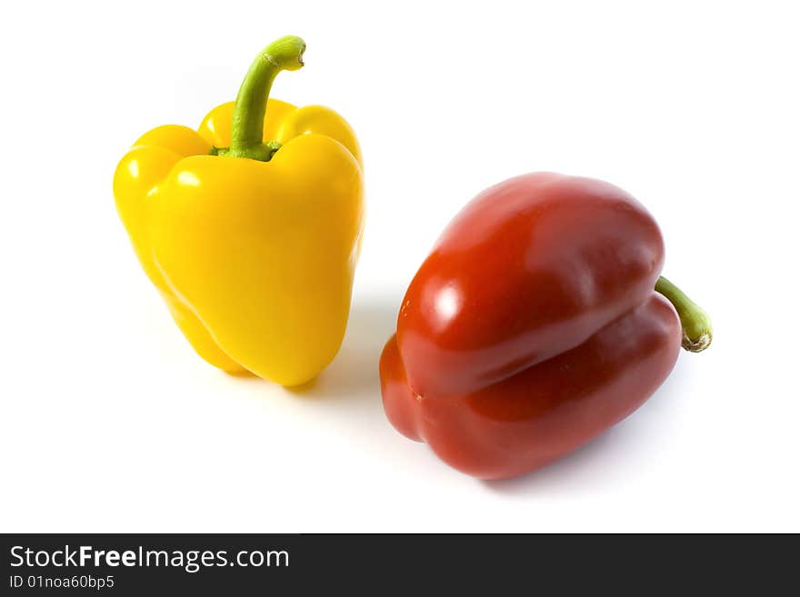 Red and yellow pepper on a white background. A photo close up