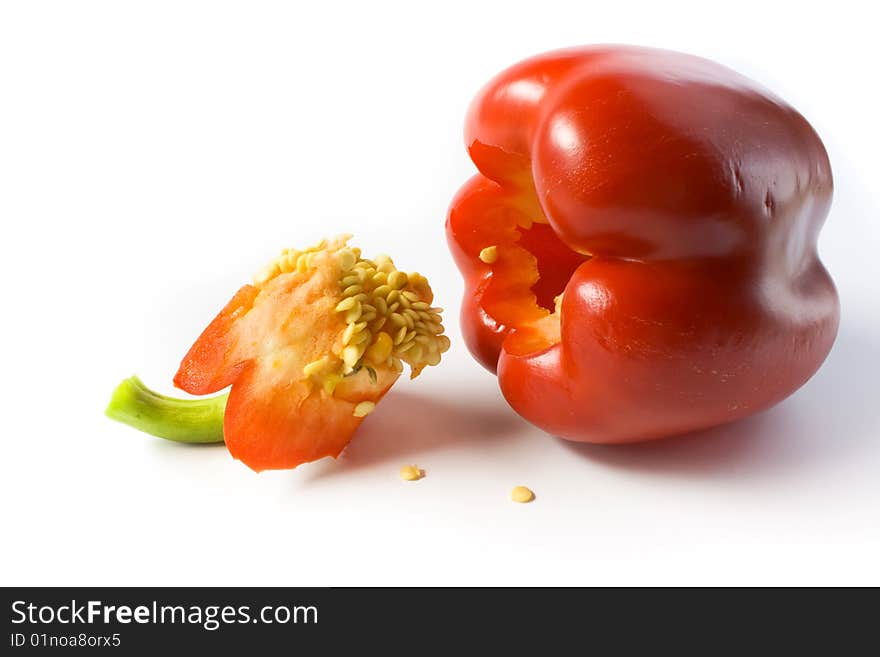 Red Pepper And Its Cut Out Core With Seeds.