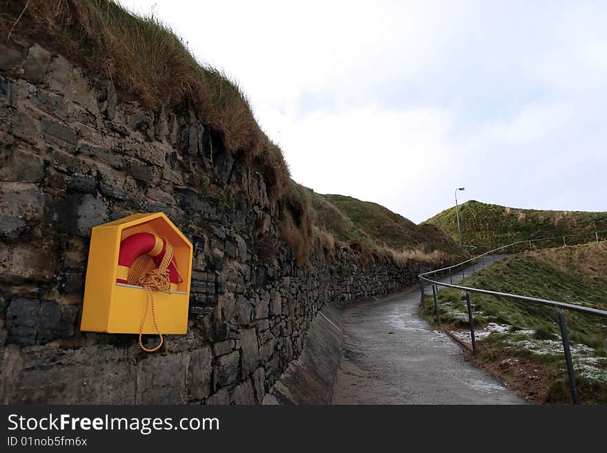 Winters snow on the ballybunion cliffside walk with safety buoy. Winters snow on the ballybunion cliffside walk with safety buoy