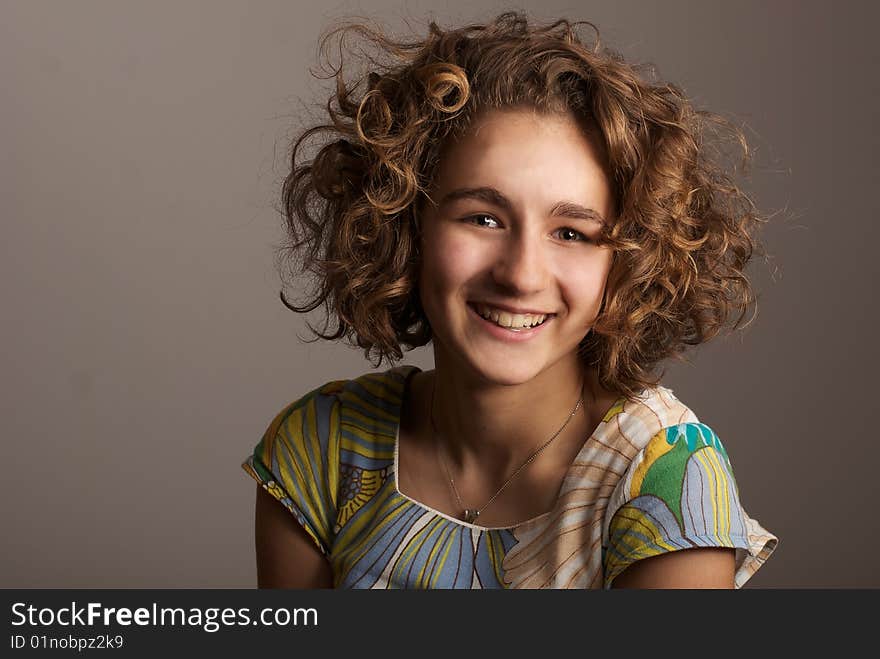 Portrait of the girl with curly hair. Portrait of the girl with curly hair