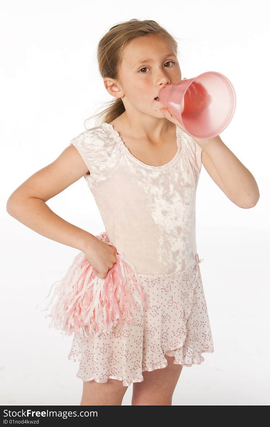 Young girl in pink cheering with megaphone. Young girl in pink cheering with megaphone.