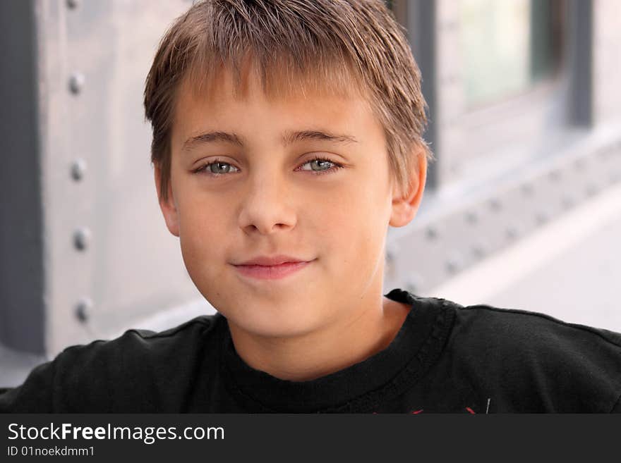 Boy looking assured with grey background