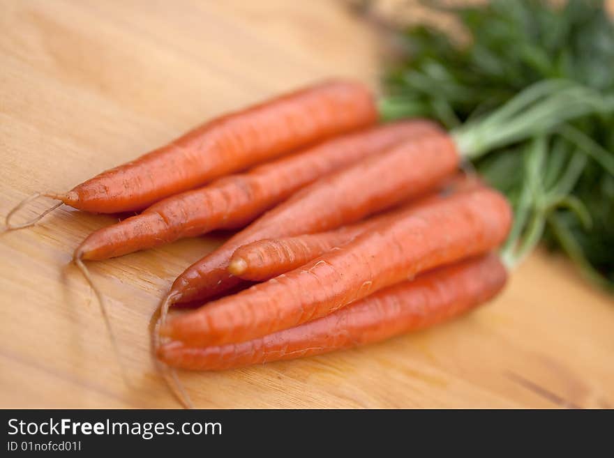 Bunches of fresh carrots for sale at a market