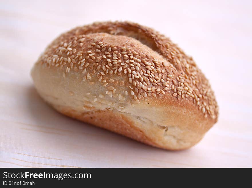 Many buns with sesame seeds , macro shot