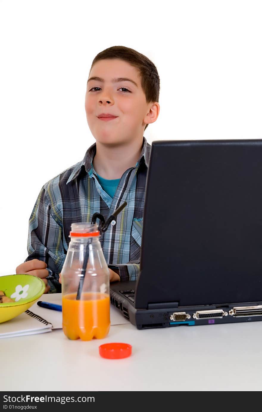 Happy smiling young boy doing studying and homework. Happy smiling young boy doing studying and homework