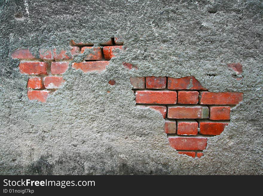 Deteriorating concrete and redbrick building