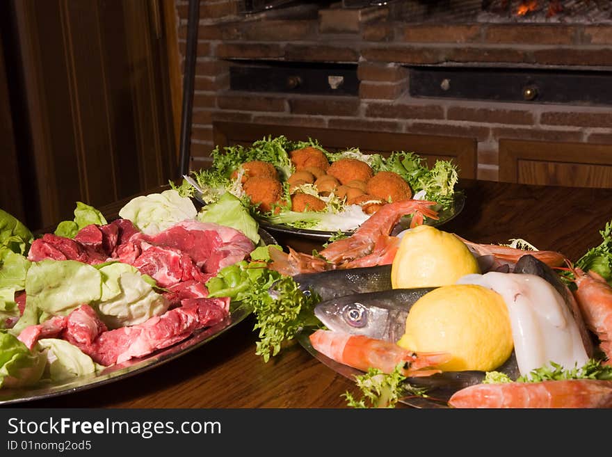 A plate of seafood in a iced container to be shown to public