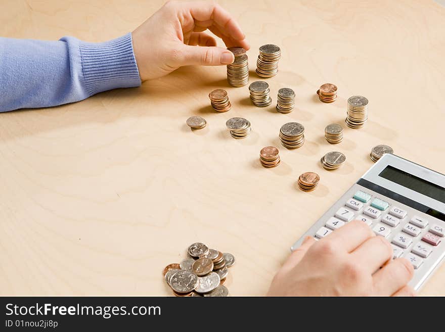 Woman stacking and organizing change. Woman stacking and organizing change