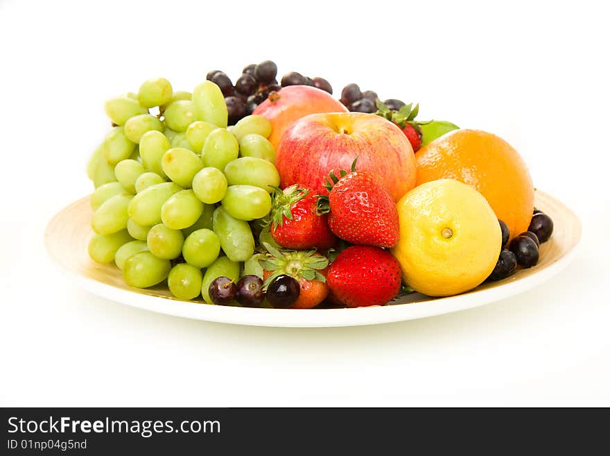 Fruit platter stocked with apples, orange, lemon, grape, strawberry and mango. Fruit platter stocked with apples, orange, lemon, grape, strawberry and mango