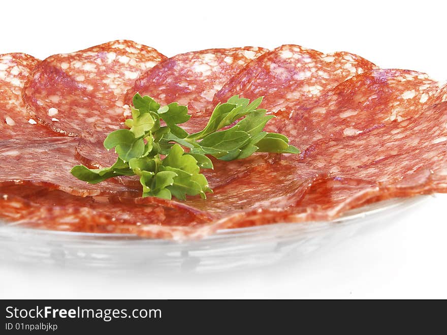 Salami, sliced and arranged on a plate