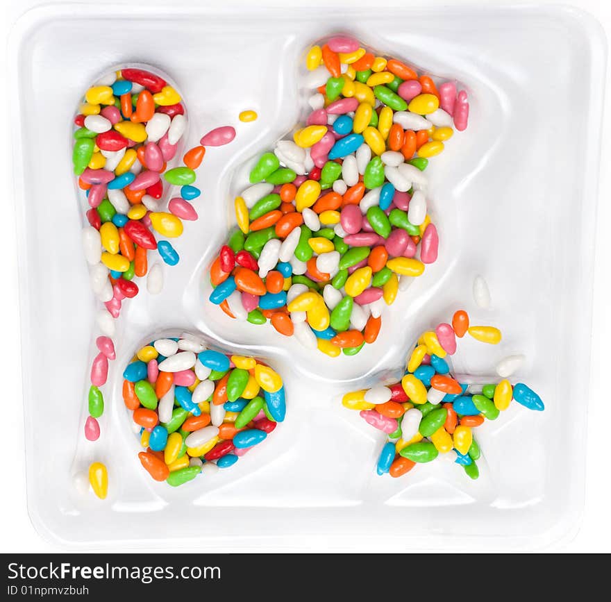 Colour sweetmeats in glaze on transparent plastic form